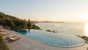 Outdoor pool, open 9:00 AM to 7:30 PM, pool umbrellas, pool loungers