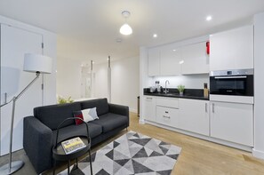 Studio Apartment-Lower Ground Floor | Living area | 32-inch flat-screen TV with digital channels, TV - Crane Court by City2Stay (London)