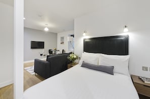 Premium bedding, in-room safe, laptop workspace, iron/ironing board