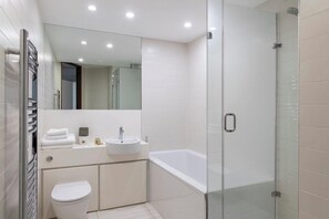 Designer toiletries, hair dryer, towels