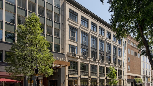 A multi-story building with large windows and a brick facade. - Cove St Martin’s (London)