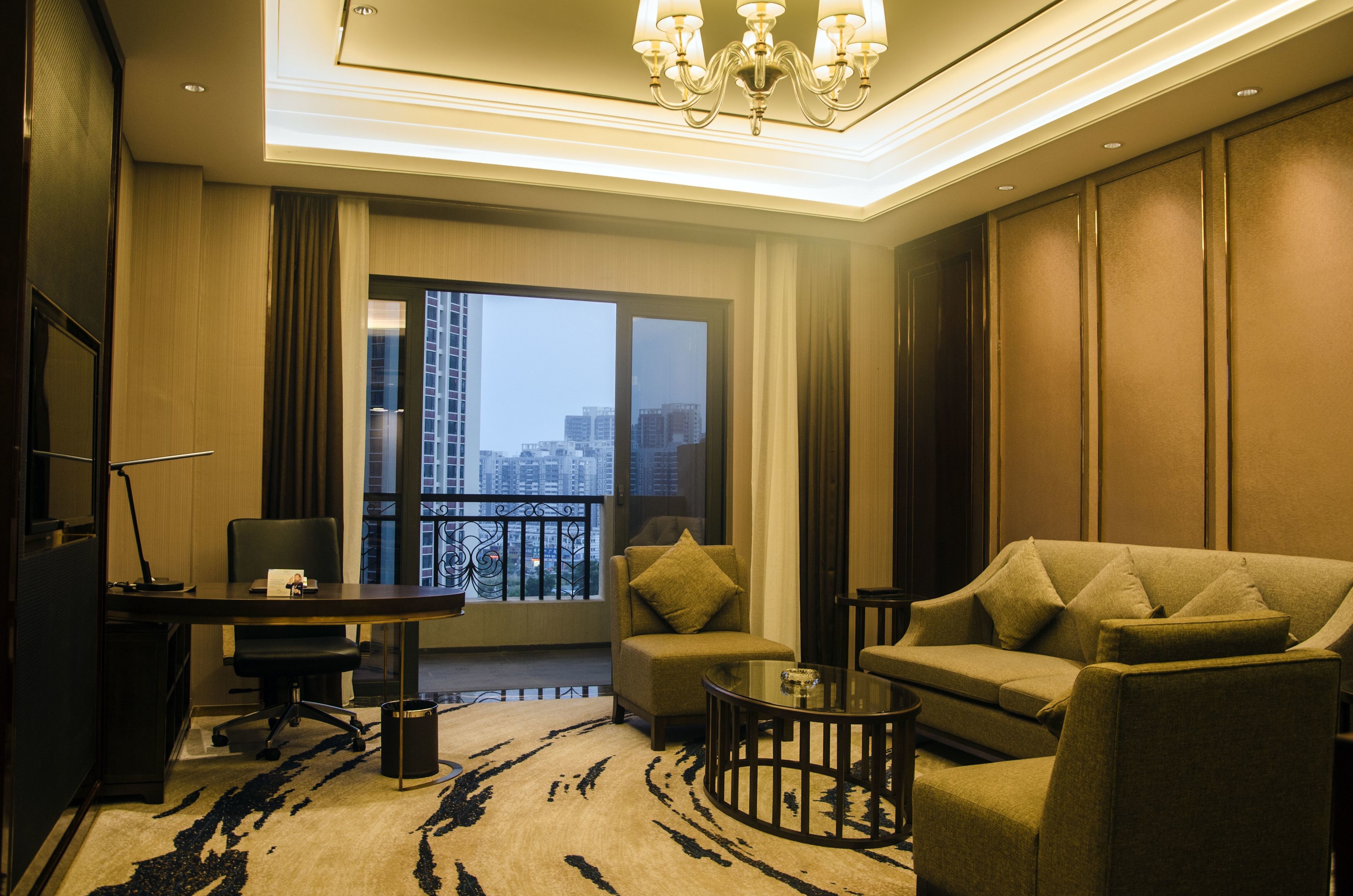 deluxe suite, 1 king bed with sofa bed, non smoking | living area | tv