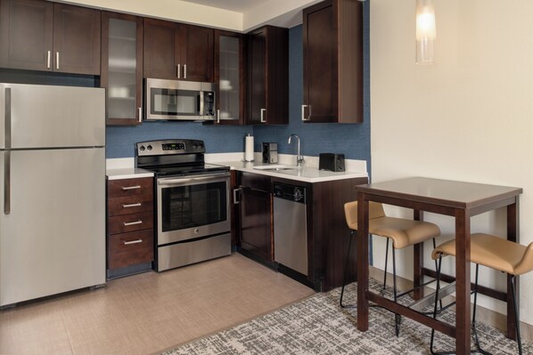 Full-sized fridge, microwave, stovetop, dishwasher