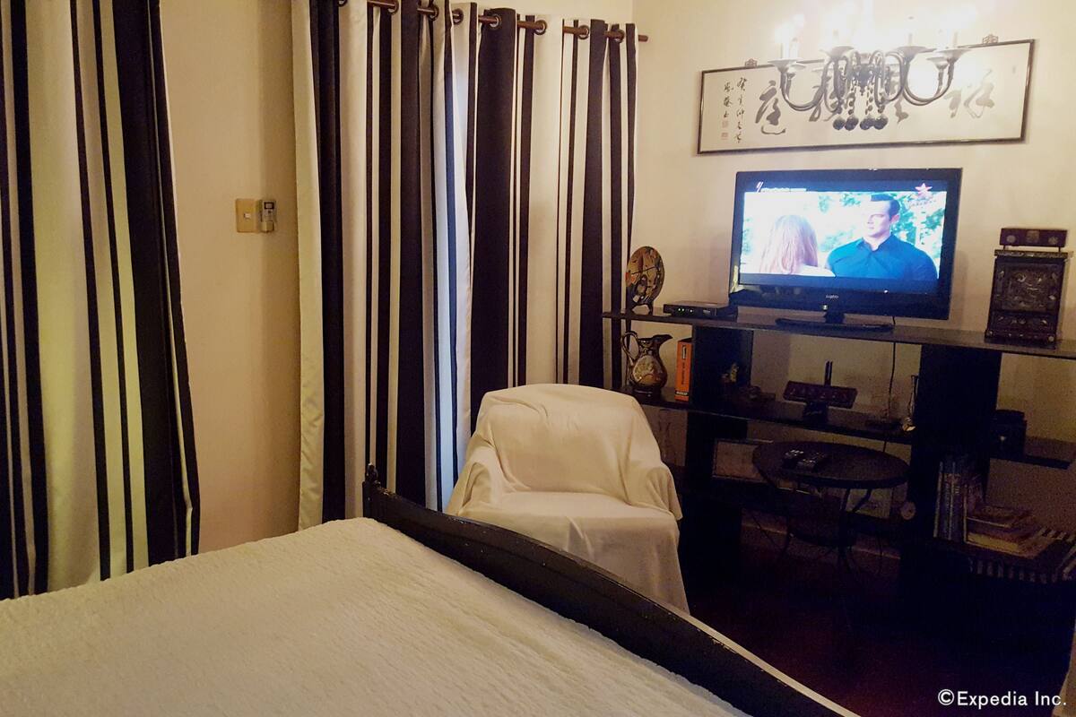 Desk, blackout curtains, iron/ironing board, rollaway beds