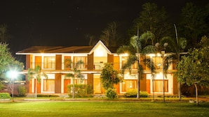 A two-story building with a tiled roof and multiple windows. - Dream Valley Resort (Hyderabad)