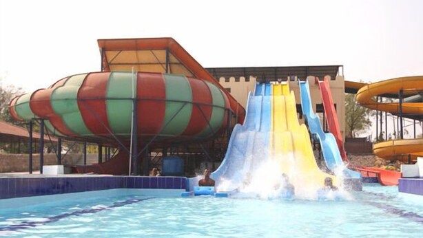 A water park with multiple water slides and a pool. - Dream Valley Resort (Hyderabad)