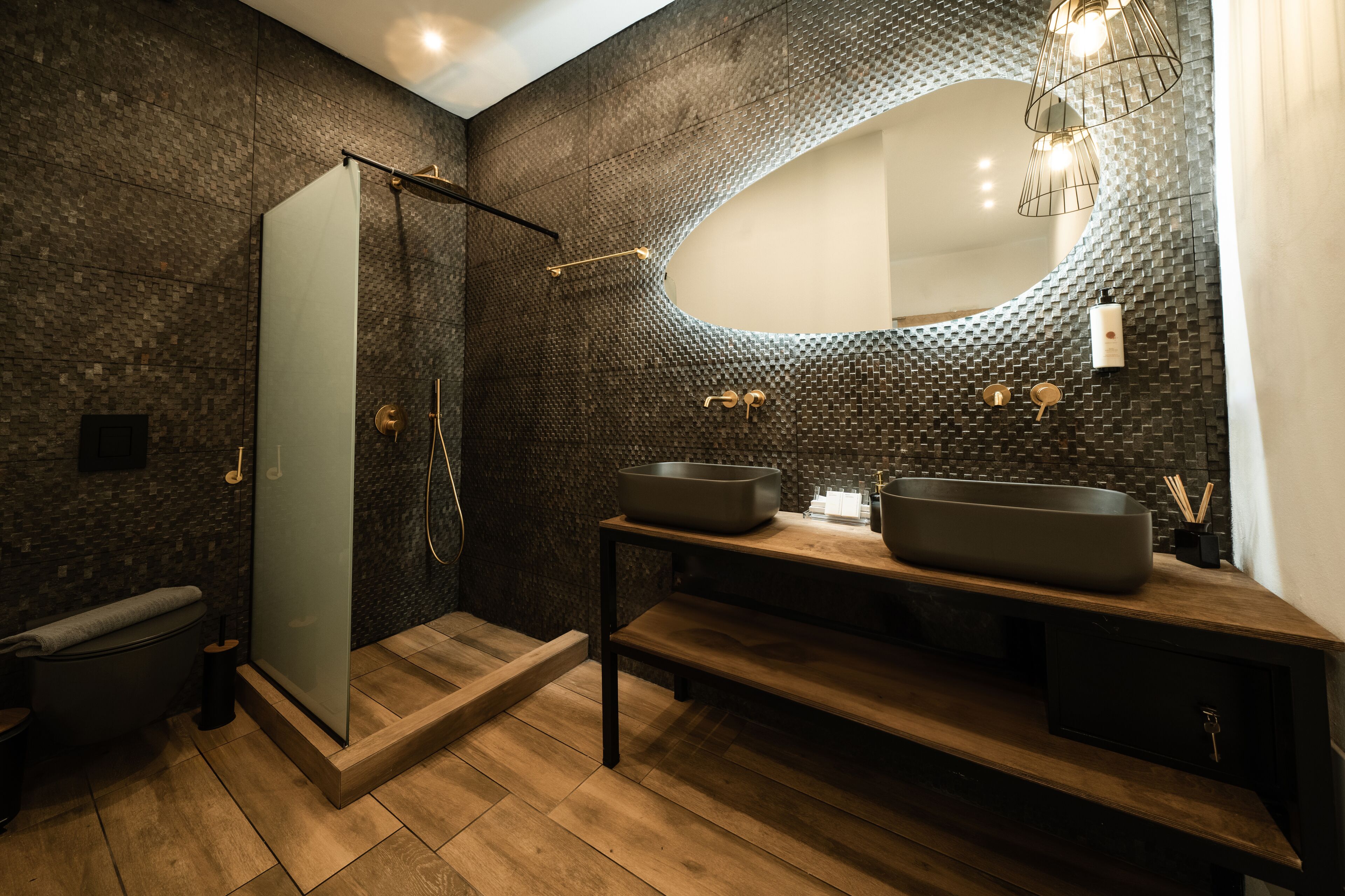 superior suite (infinity hot tub) | bathroom | free toiletries, hair dryer, slippers, towels