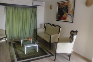 Apartment, 1 Bedroom, Kitchenette | Living area | Flat-screen TV - Grand Hôtel d'Abidjan (Abidjan)