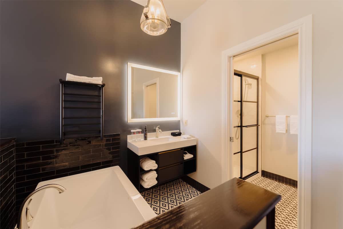 designer toiletries, hair dryer, towels, soap