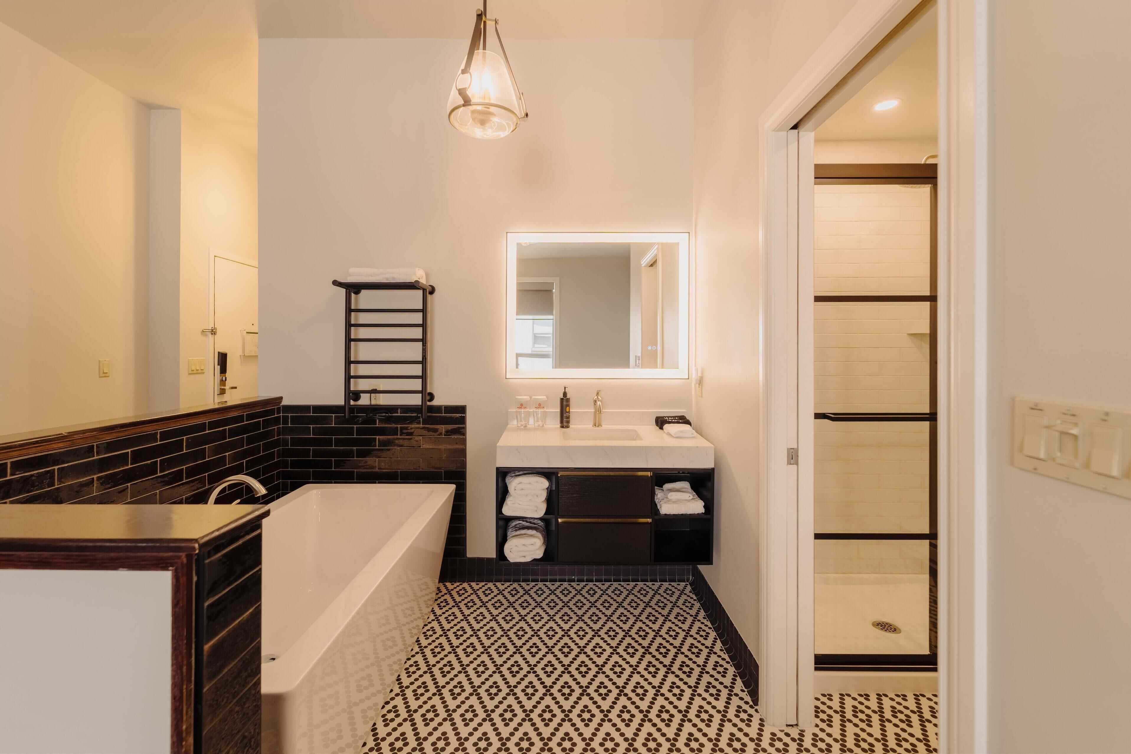 designer toiletries, hair dryer, towels, soap