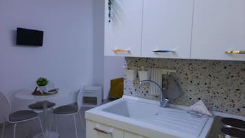 Economy Triple Room, 1 Bedroom, No Windows | Private kitchen | Fridge, stovetop, espresso maker, coffee/tea maker