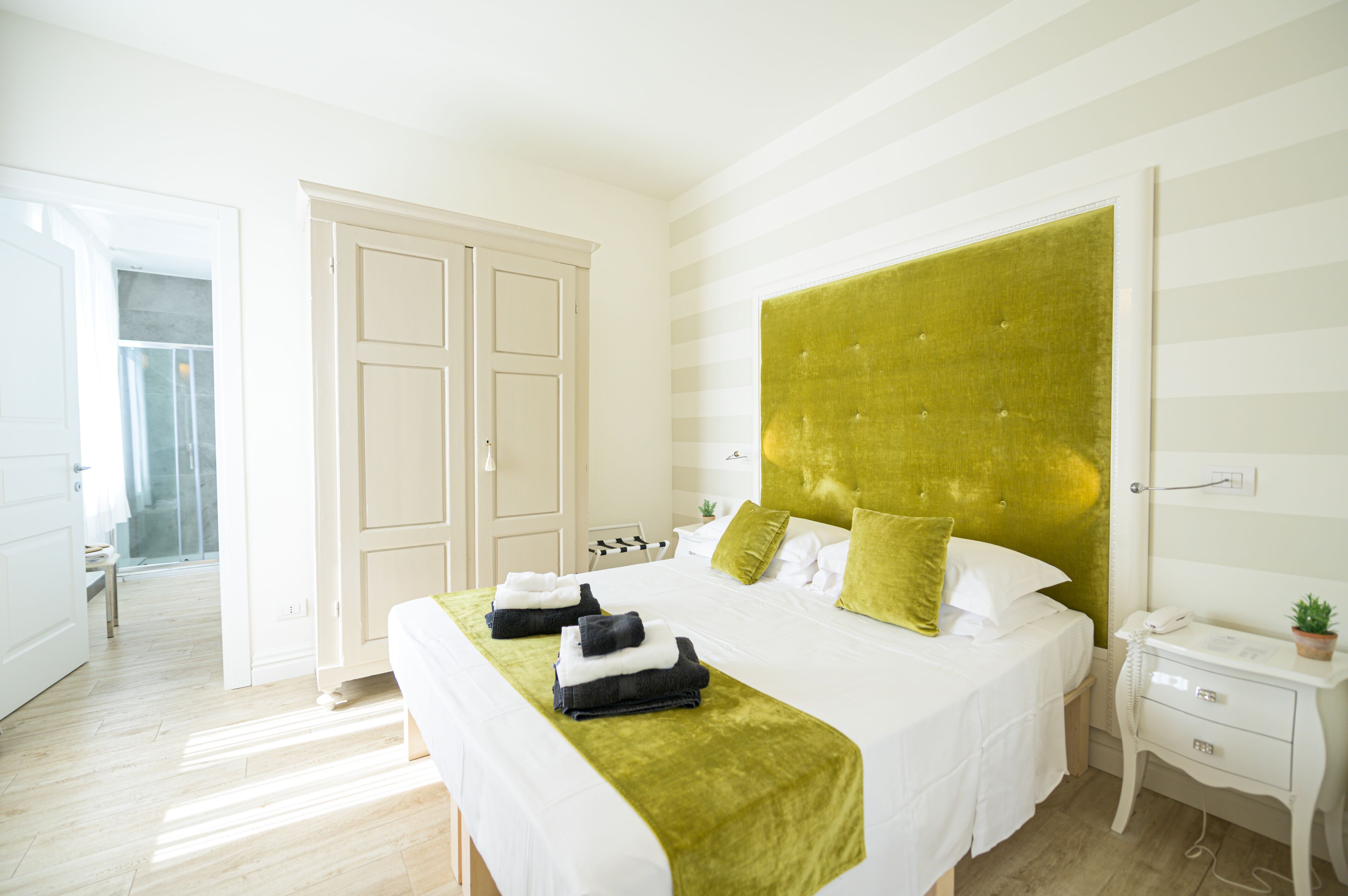 Premium bedding, down comforters, pillowtop beds, minibar