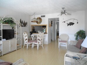 Pool View One Bedroom Condo with Double Beds and Pullout | Living room | Flat-screen TV