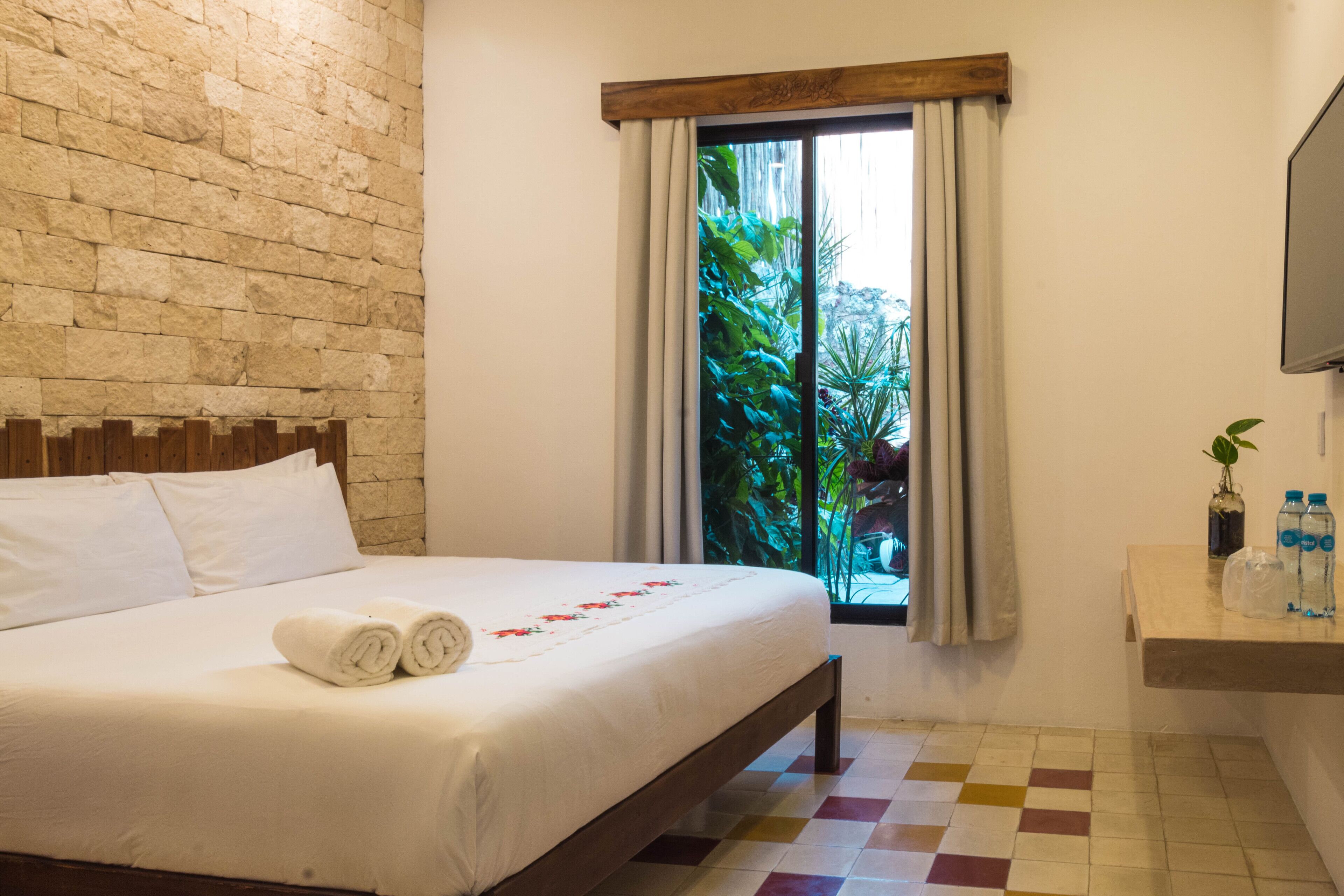 luxury room, 1 king bed, non smoking, pool view | 1 bedroom, down duvets, in-room safe, individually decorated