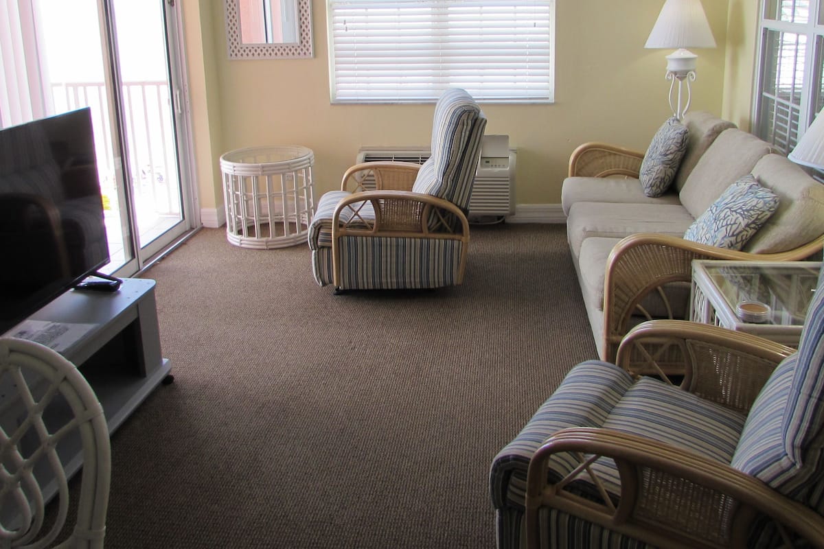 Apartment, 1 King Bed, Partial Ocean View | In-room safe, desk, laptop workspace, iron/ironing board