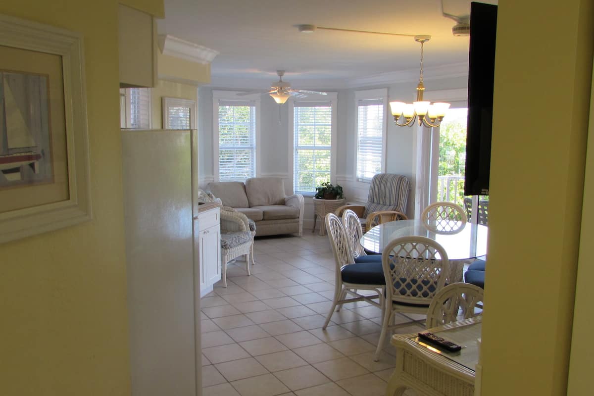 Apartment, 2 Bedrooms, Partial Ocean View | In-room safe, desk, laptop workspace, iron/ironing board