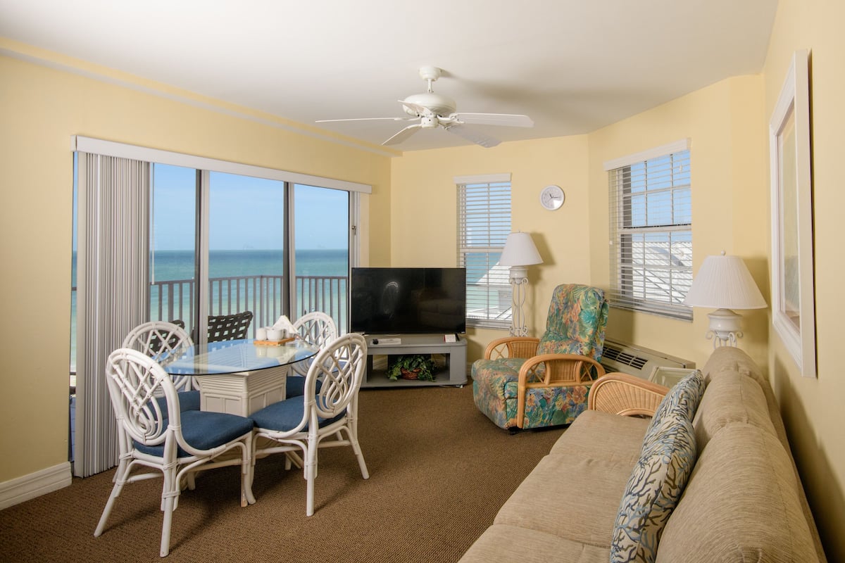Apartment, Multiple Beds, Partial Ocean View | In-room safe, desk, laptop workspace, iron/ironing board
