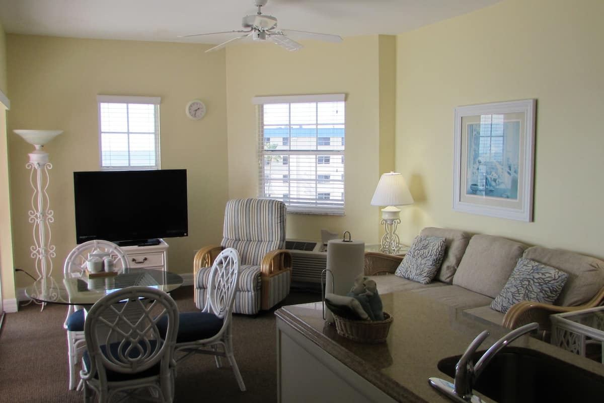 Apartment, Multiple Beds, Partial Ocean View | In-room safe, desk, laptop workspace, iron/ironing board