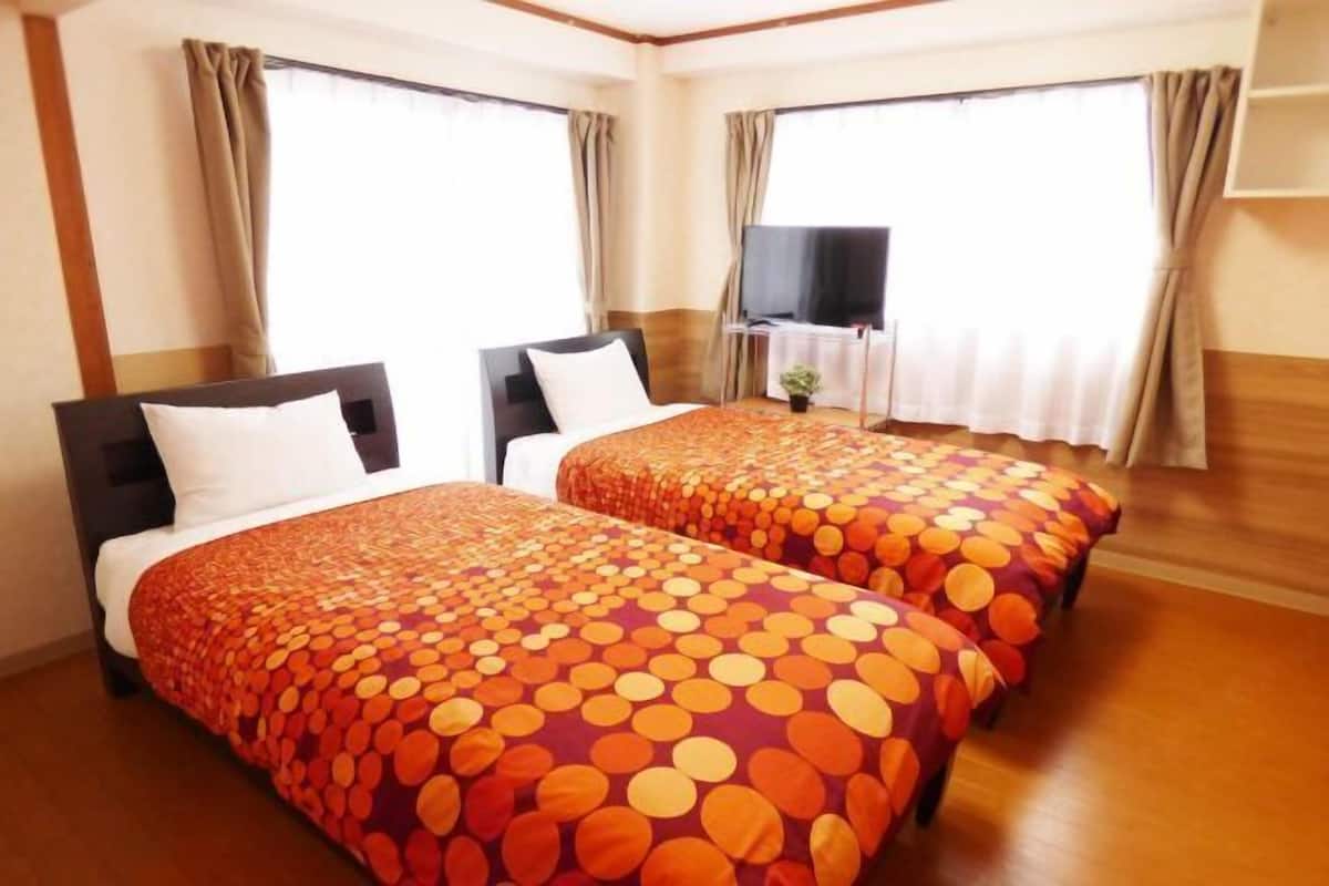 Desk, blackout curtains, free cots/infant beds, free WiFi