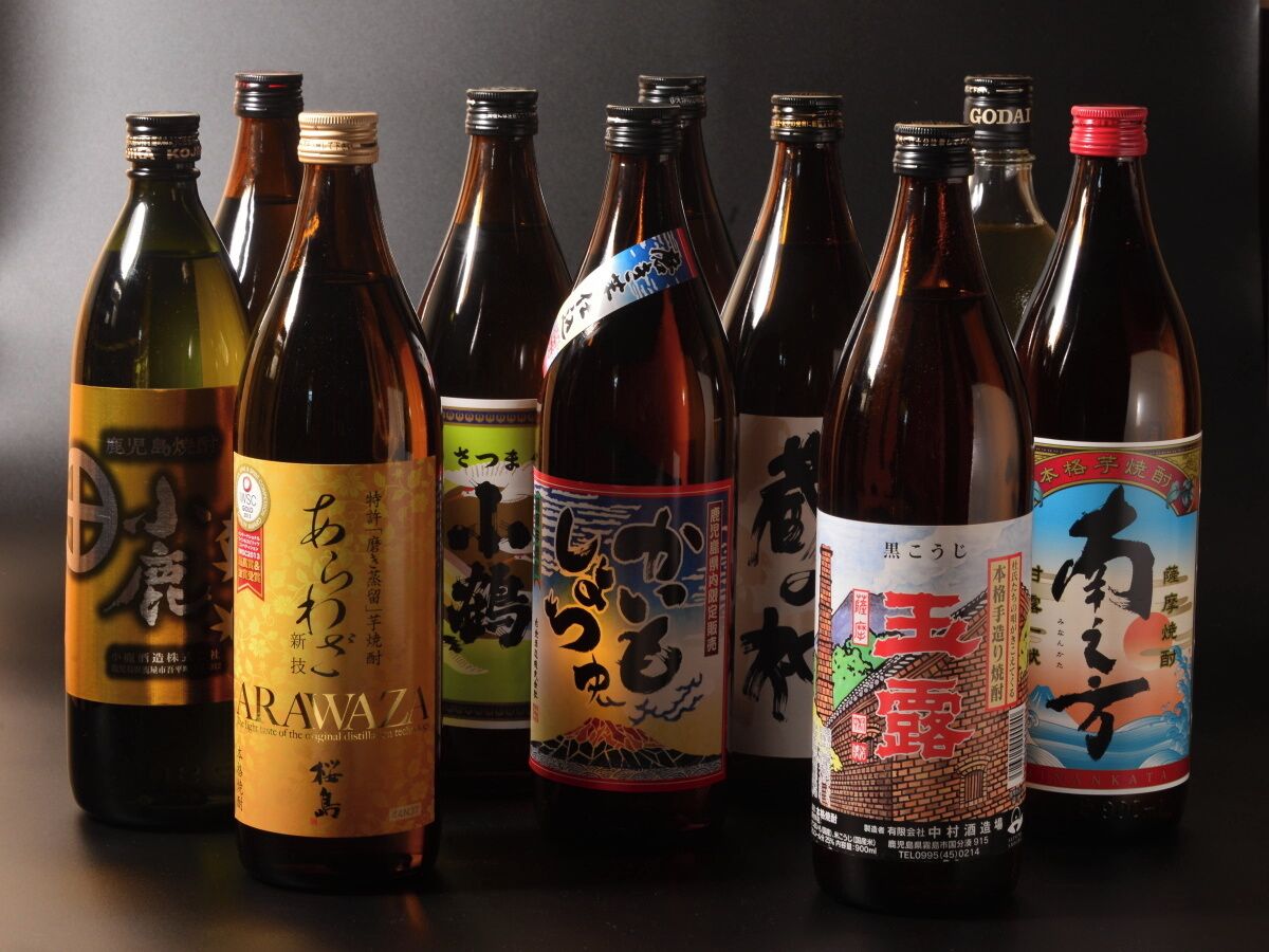 A collection of bottles with Japanese labels, likely containing beverages or spirits.
