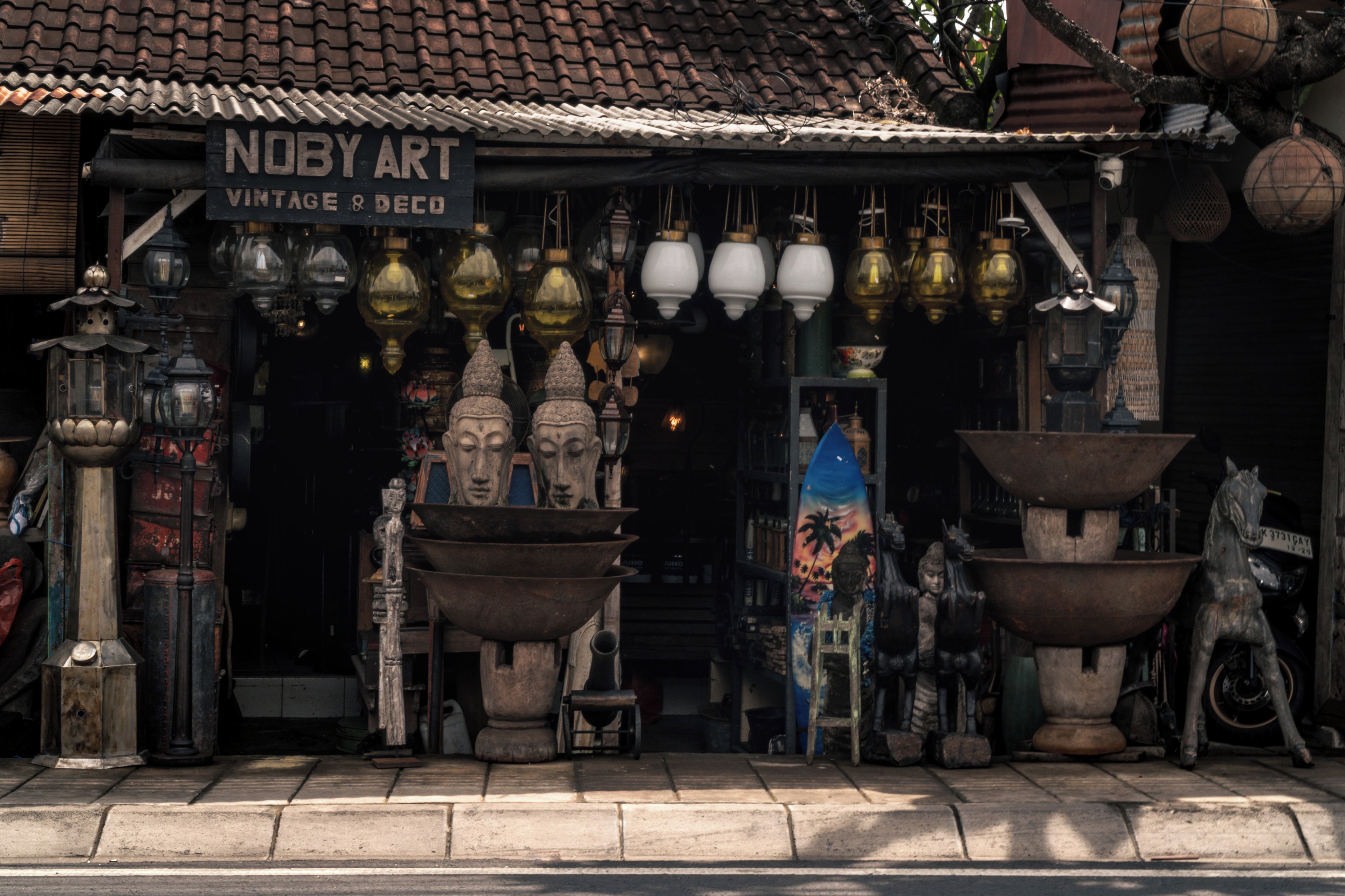 A shop with a sign reading 'NUBY ART' selling vintage and decorative items.
