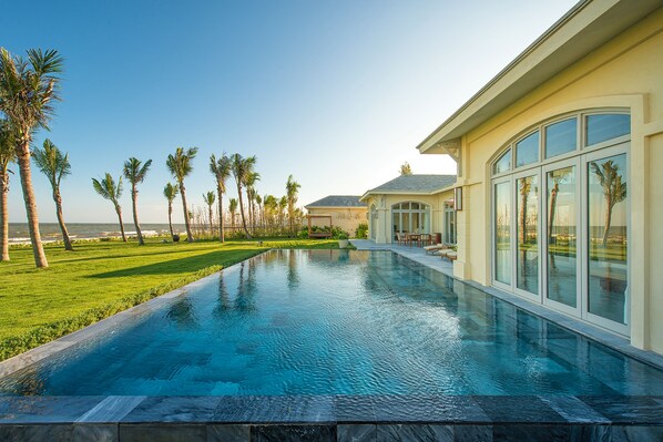 Outdoor pool, pool umbrellas, sun loungers