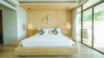 Sirarun Beachfront Pool Villa | Minibar, in-room safe, desk, blackout drapes