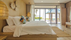 A spacious bedroom with a large bed, a wooden headboard, and a view of a pool through glass doors. - Sirarun Resort (Thap Sakae)