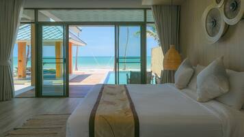 Sirarun Beachfront Villa | Minibar, in-room safe, desk, blackout curtains