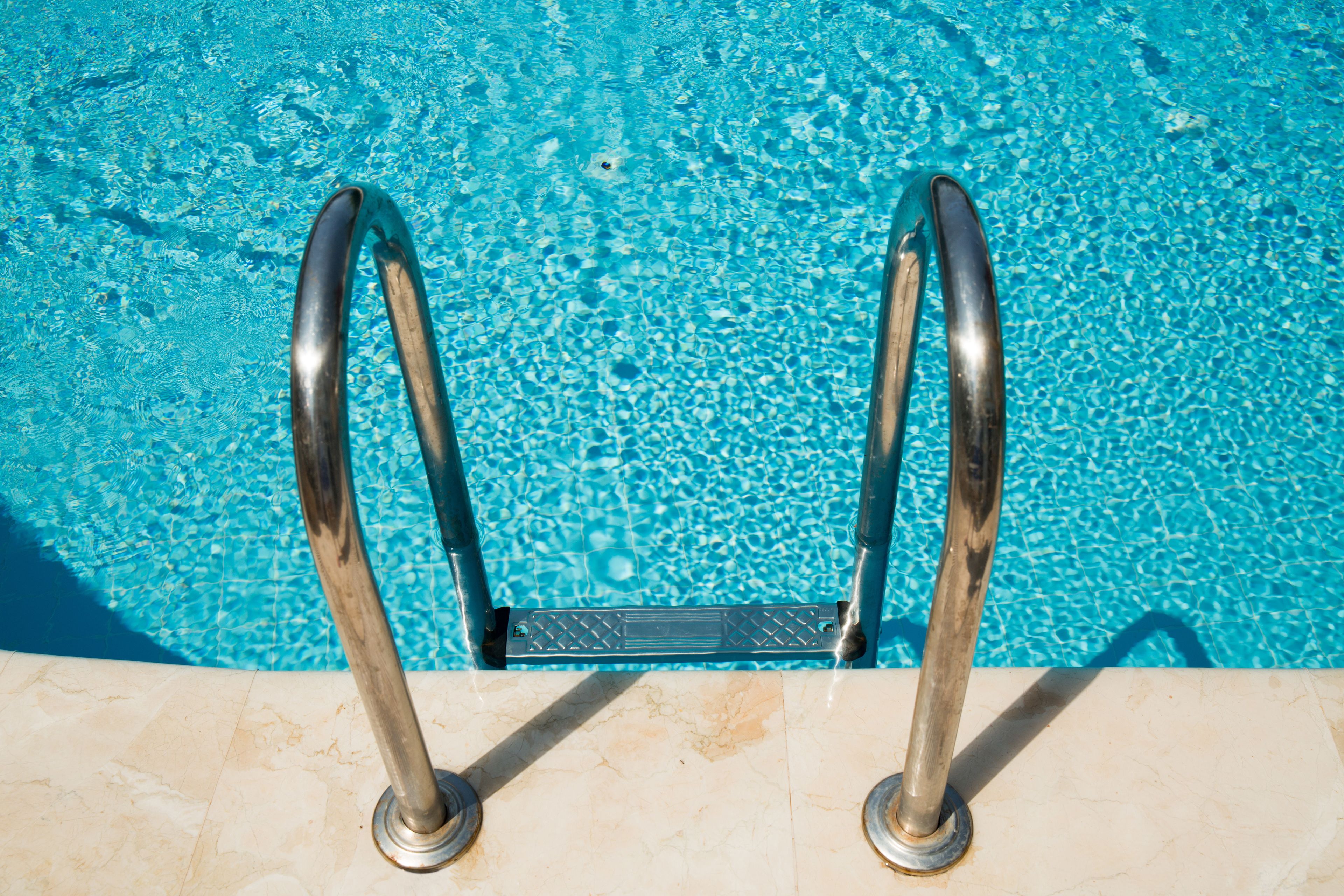 outdoor pool, pool umbrellas, pool loungers