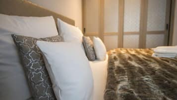 Deluxe Suite, 2 Bedrooms, Garden View | 1 bedroom, premium bedding, free minibar items, in-room safe