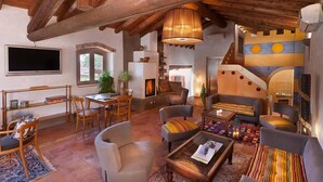 A spacious living area with a high wooden ceiling, a fireplace, and a cozy seating arrangement. - Boutique Hotel Villa dei Campi (Gavardo)