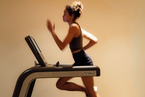 A person running on a treadmill.