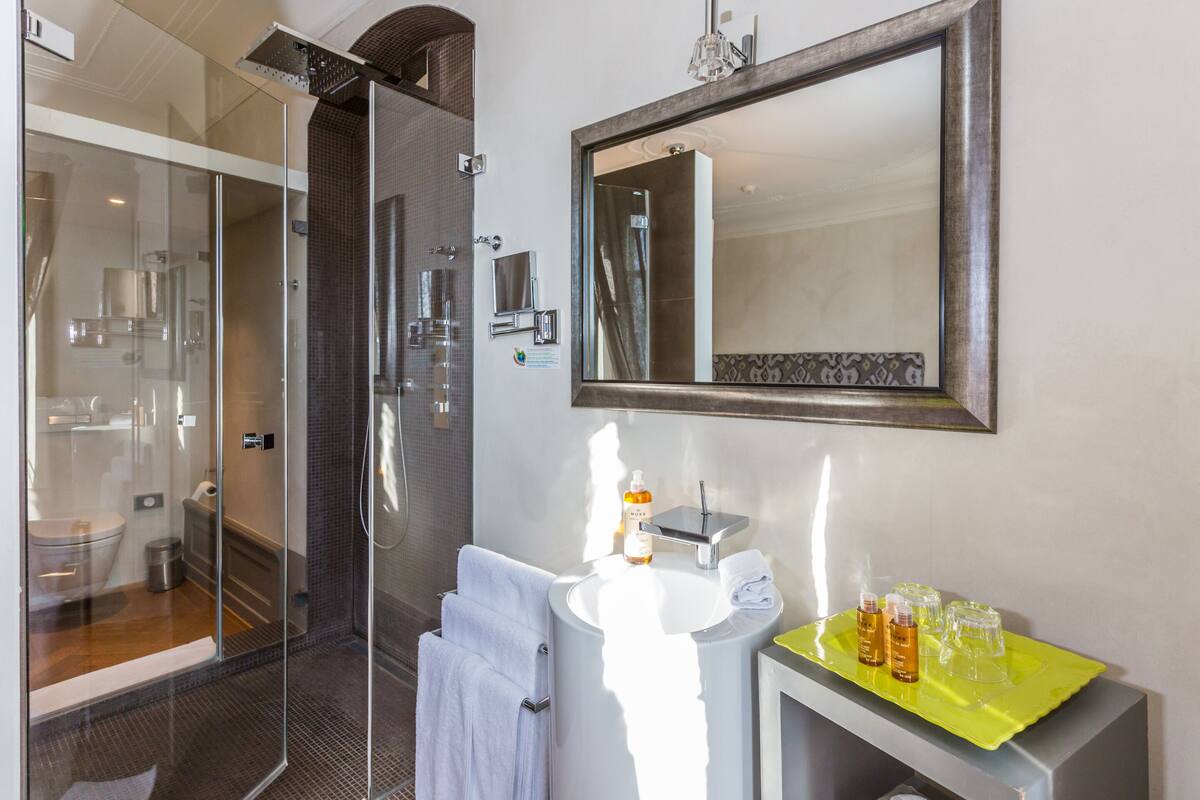 room, balcony | bathroom | rainfall showerhead, designer toiletries, hair dryer, slippers