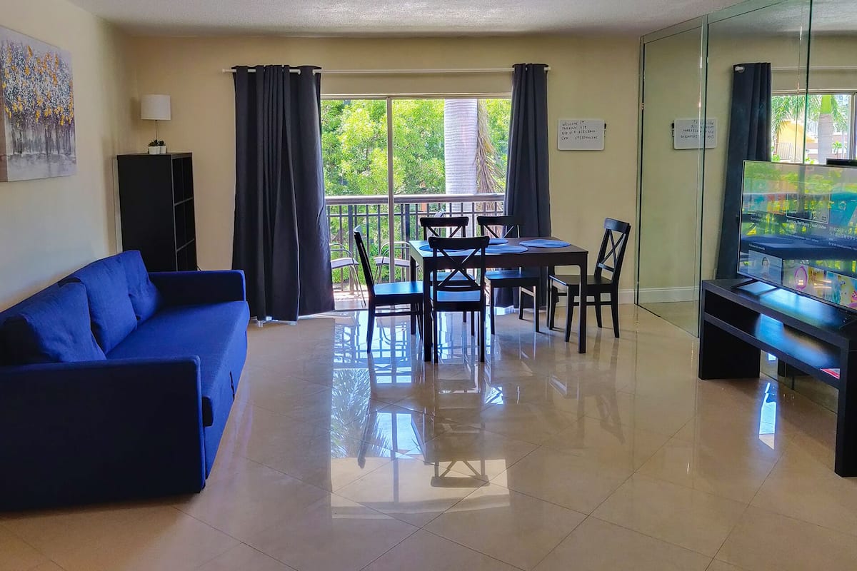 Classic Apartment, 2 Bedrooms | Living area | 55-inch flat-screen TV with cable channels, TV