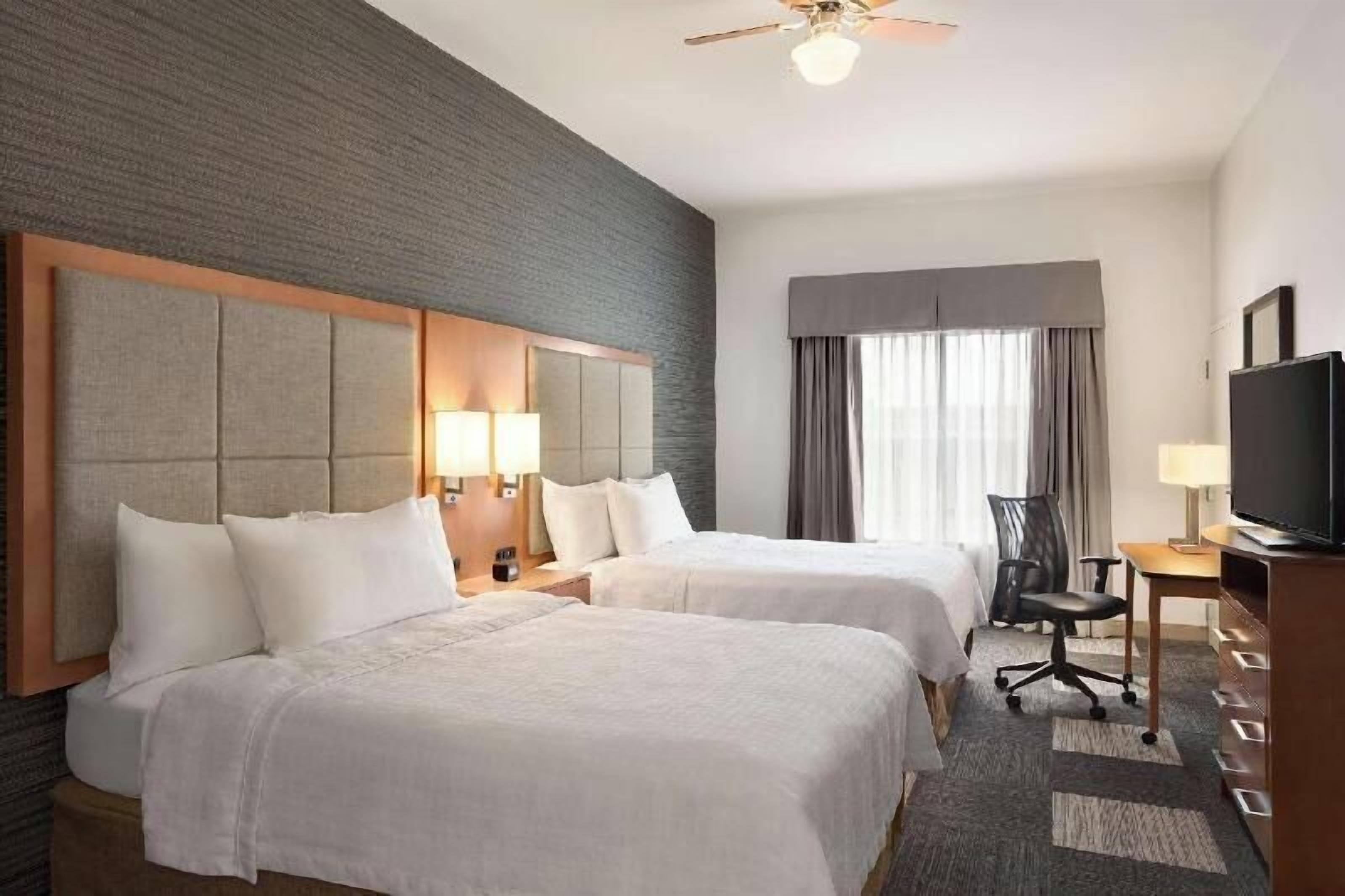 Desk, laptop workspace, blackout drapes, iron/ironing board