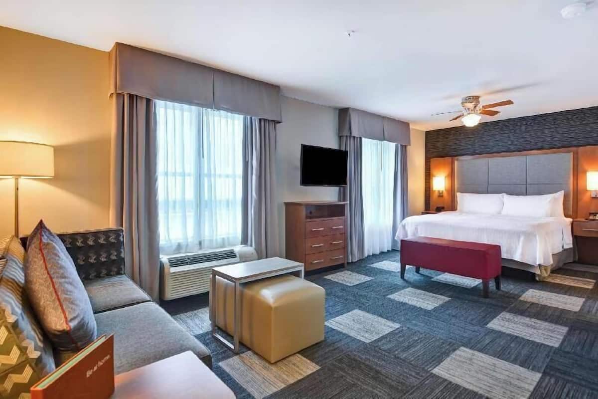 Desk, laptop workspace, blackout drapes, iron/ironing board