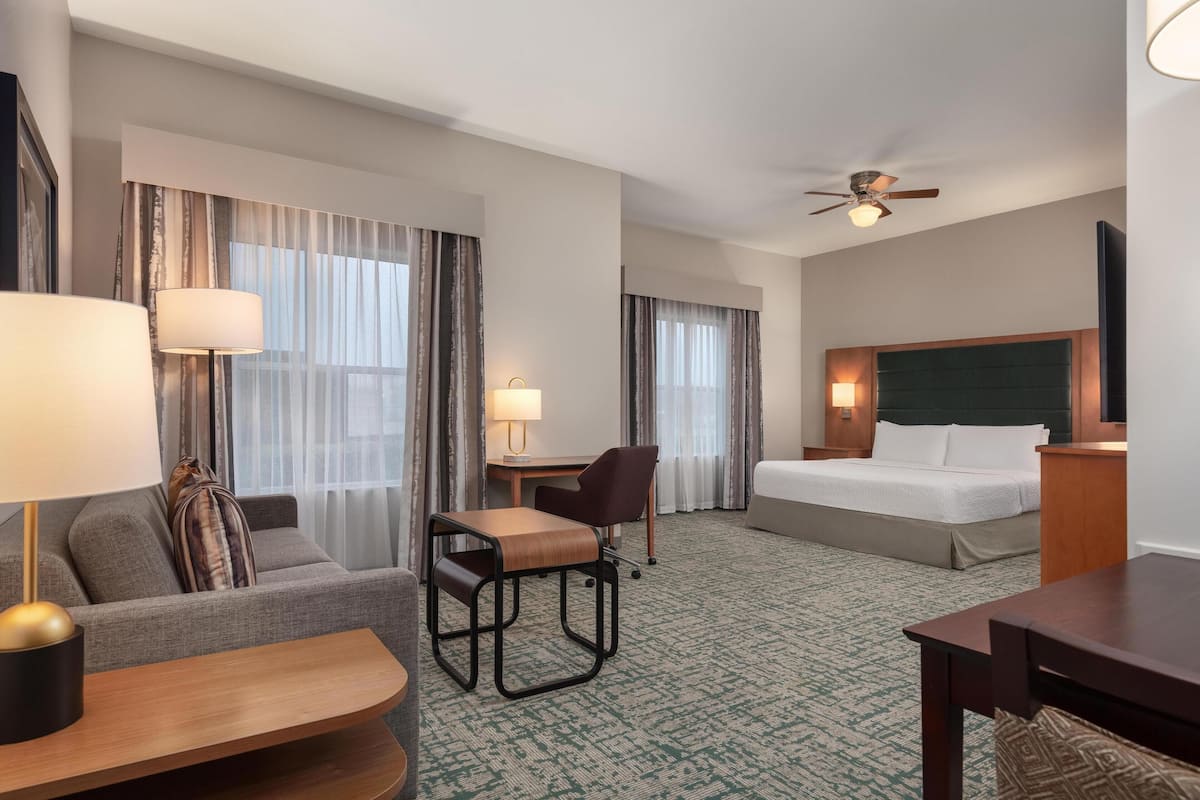 Desk, laptop workspace, blackout drapes, iron/ironing board