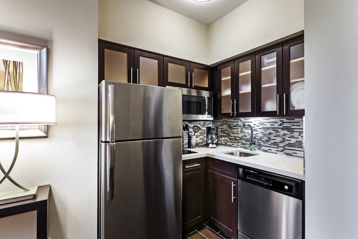 studio suite, 1 queen bed, kitchen | private kitchen | full-sized fridge, microwave, stovetop, dishwasher