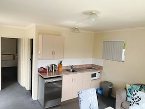 Family One Bedroom Apartment | Living area | 50-inch Smart TV with digital channels