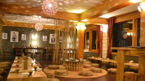 A traditional Japanese-style room with tatami mats, low tables, and a central tatami mat arrangement. - The Hill Station Boutique Hotel (Sa Pa)