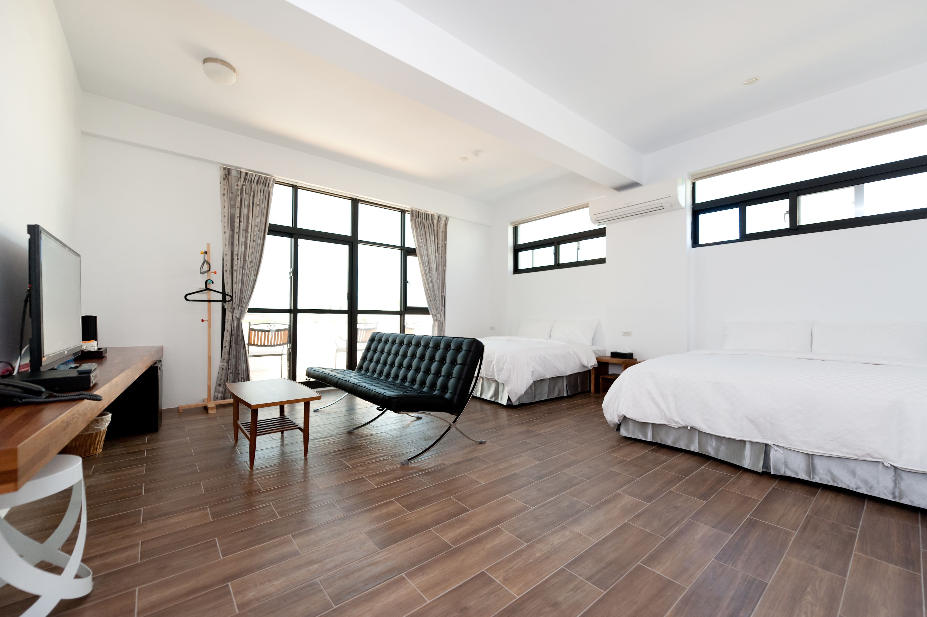 superior quadruple room | living area | flat-screen tv