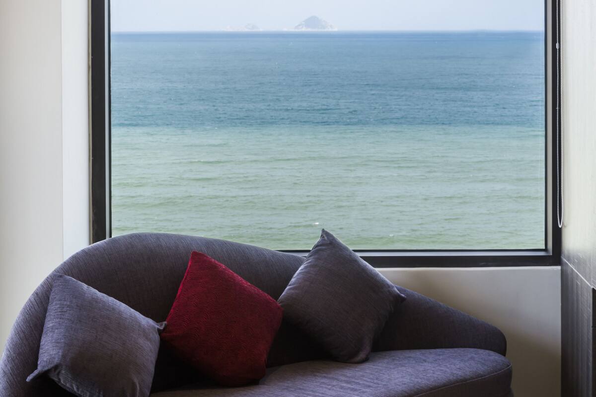 suite, sea view | living area | 42-inch flat-screen tv with cable channels, tv