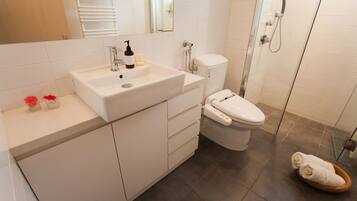 Townhome | Bathroom | Shower, hair dryer, slippers, electronic bidet