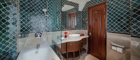 A bathroom with a bathtub, a sink, and a toilet.