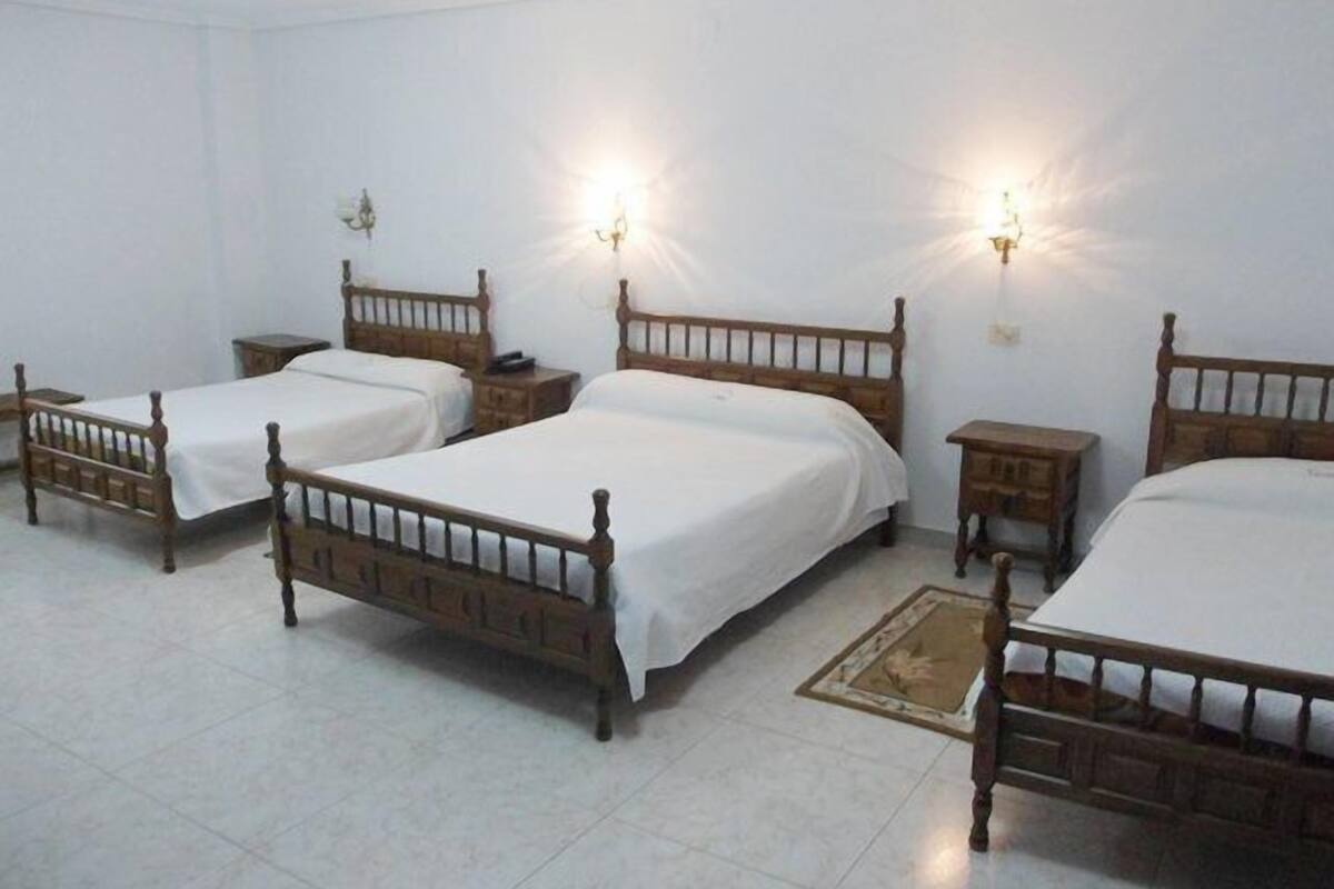 Triple Room | In-room safe, desk, laptop workspace, blackout drapes