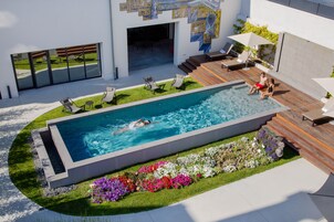 Seasonal outdoor pool, open 8:00 AM to 9:00 PM, sun loungers