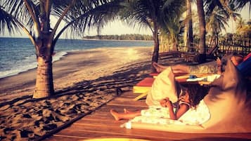 Private beach, black sand, beach towels, beach massages