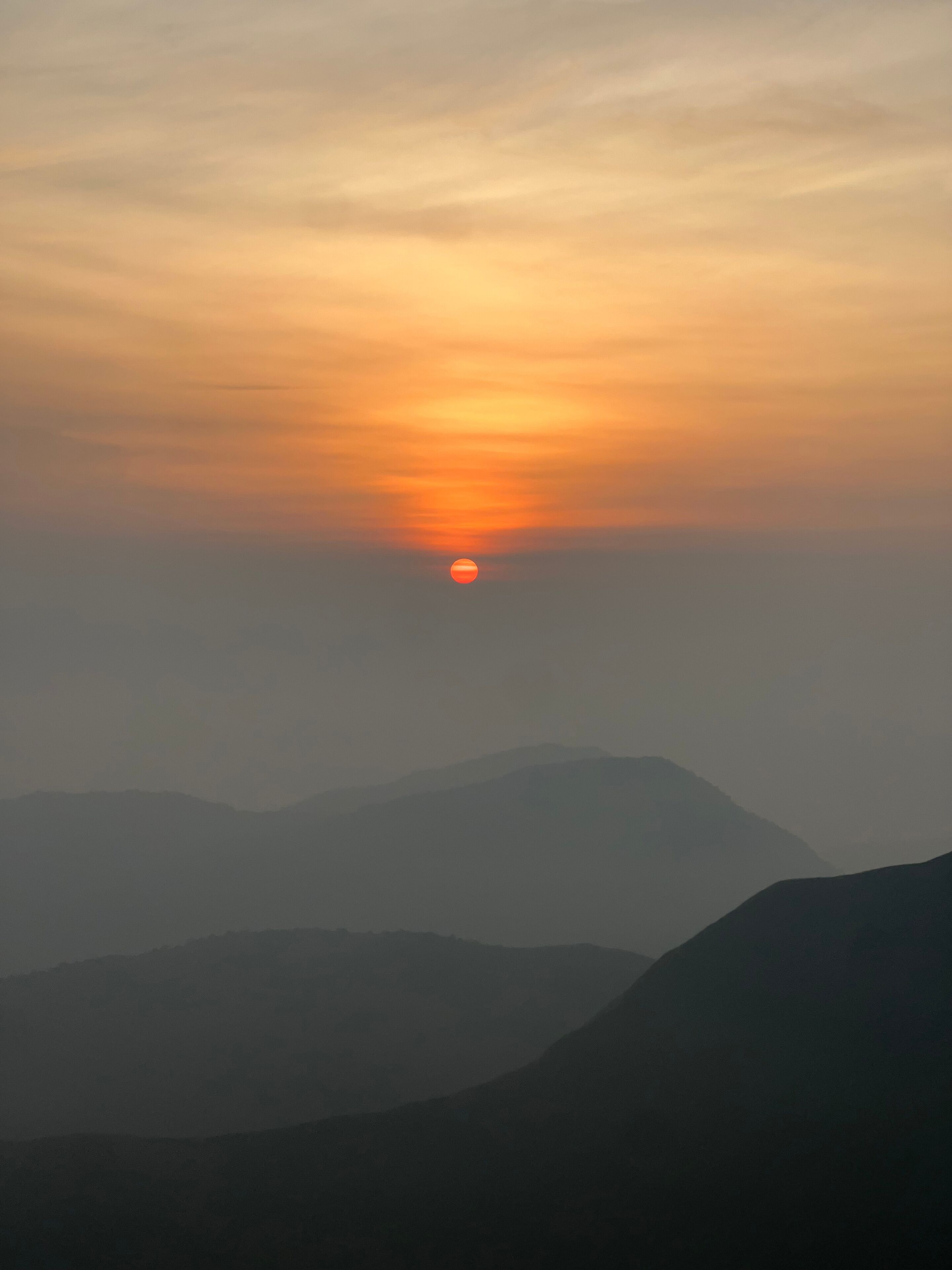 A sunset over a mountain range.