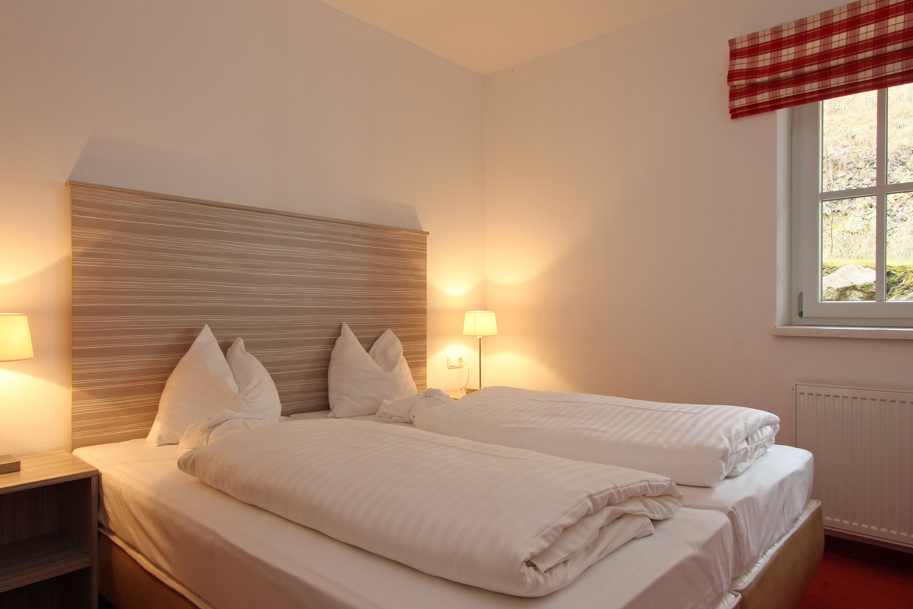 Premium bedding, blackout curtains, soundproofing, iron/ironing board